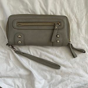 Grey wallet. Plenty of pockets including one for a checkbook and pen.